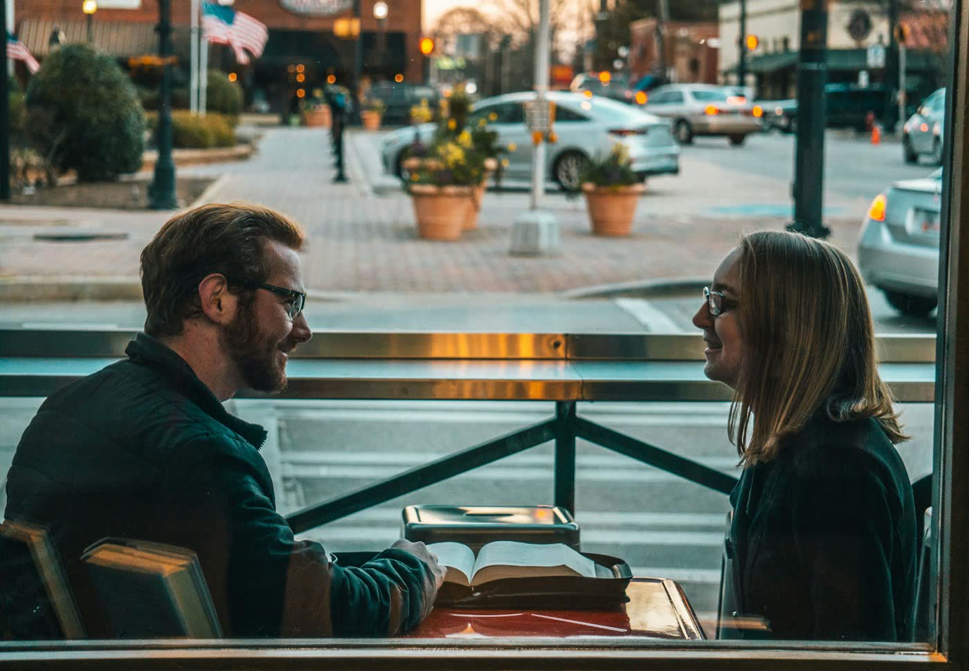 Two people having a thoughtful conversation before marriage