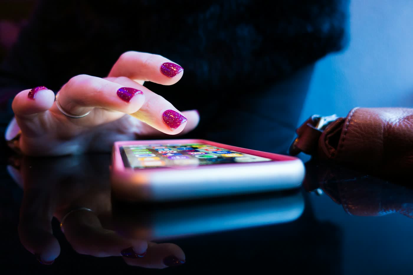 Person comparing matrimonial apps on a smartphone