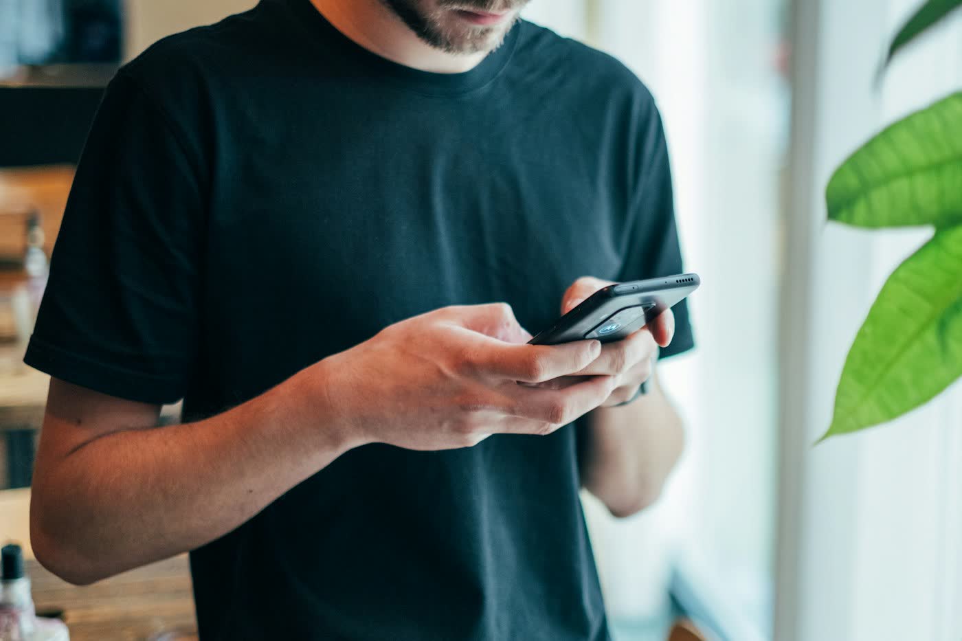 Person using a smartphone to explore a matrimony app