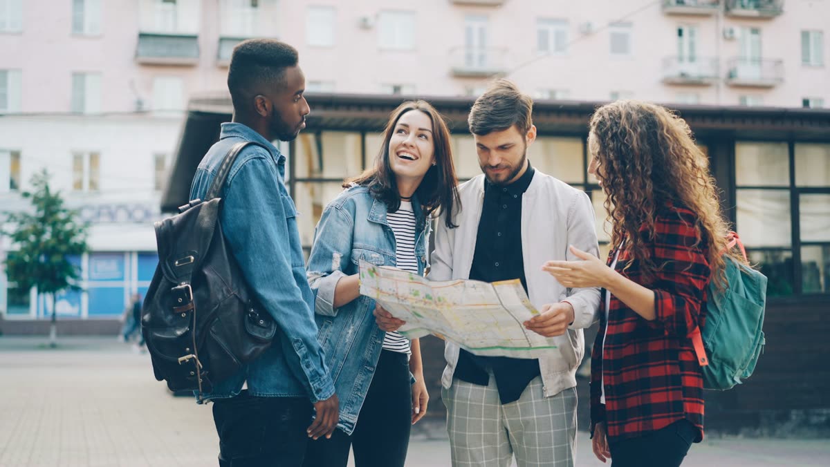 Two travellers discussing a trip over a map